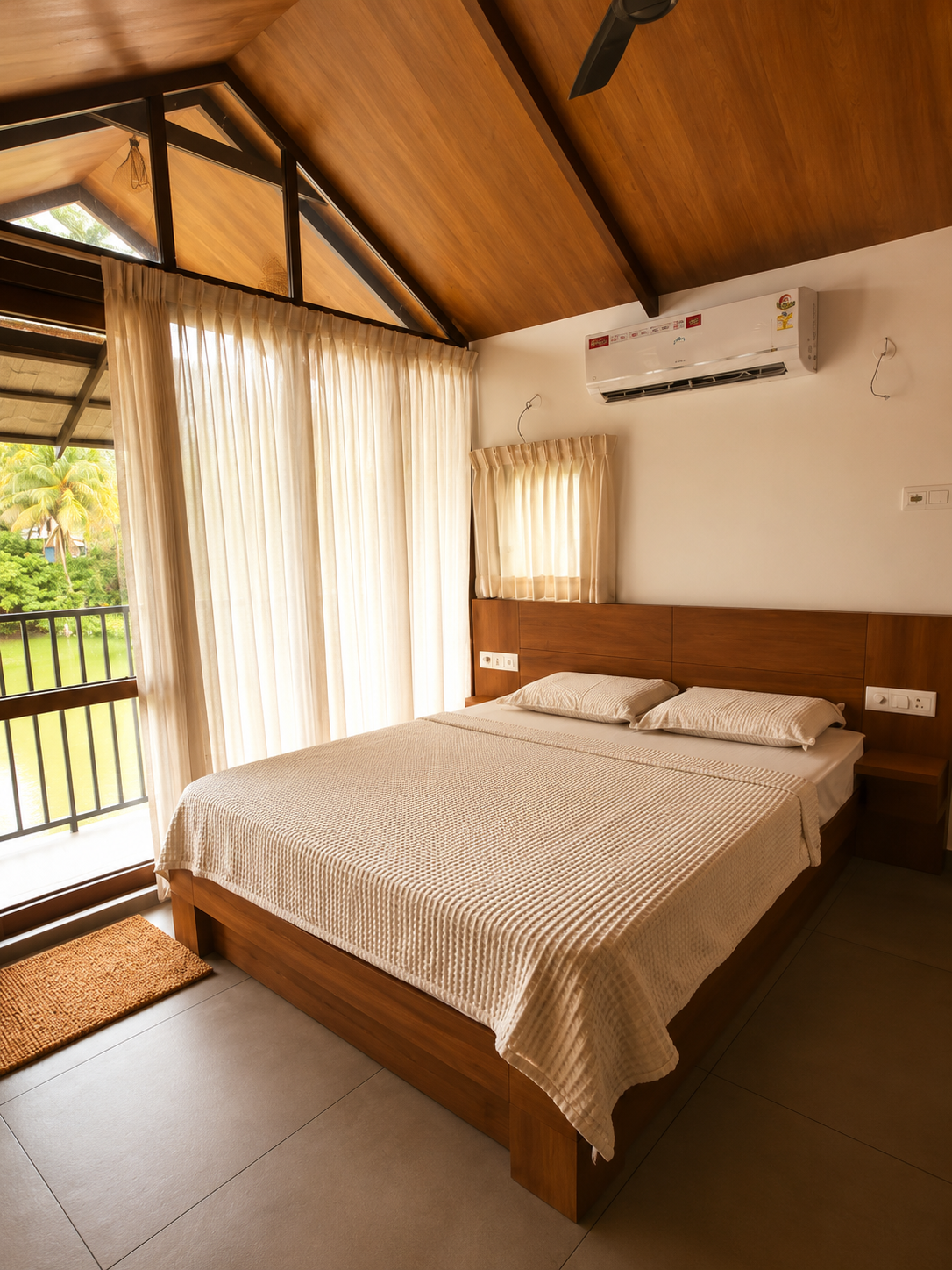 River Hut queen bed with river view — Maleyam Homestay